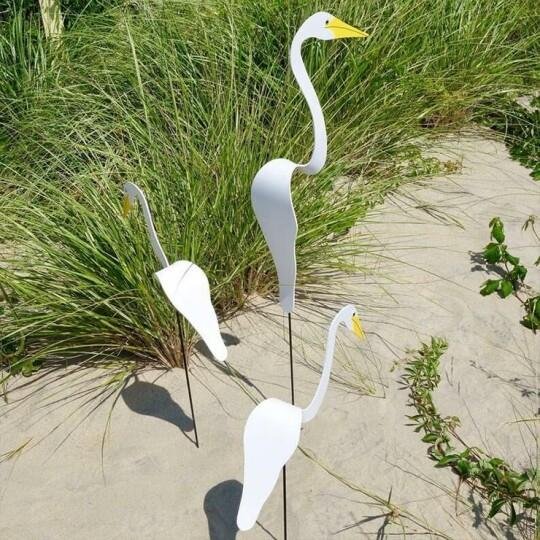 A whimsical and dynamic bird that spins with the slight garden breeze